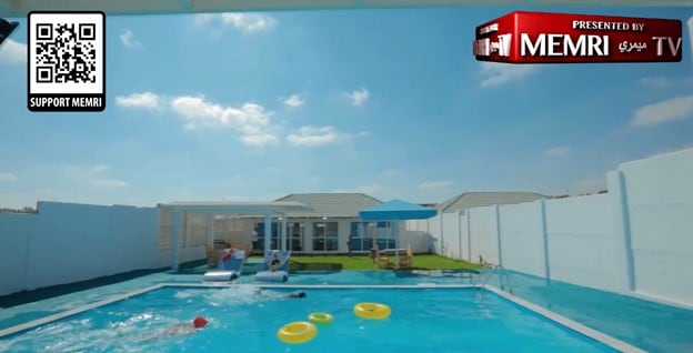 A swimming pool with a house in the background
Description automatically generated with low confidence