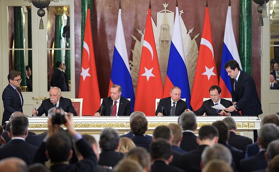 Description: Signing of documents following Russian-Turkish talks.