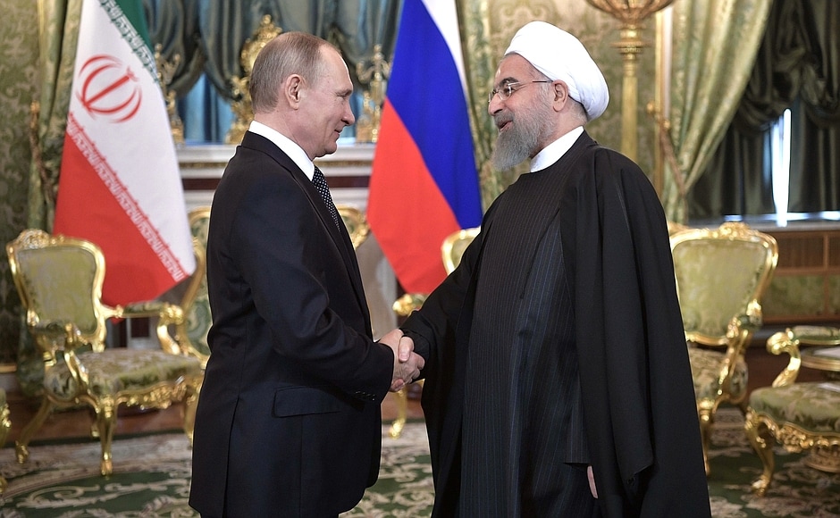 Description: With President of Iran Hassan Rouhani.